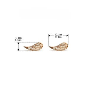 May include: A pair of gold-colored wing-shaped stud earrings. Each earring is encrusted with small, clear gemstones. The earrings measure 0.4 inches in length and 0.16 inches in width. The earrings are displayed on a white background.