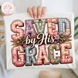 May include: White t-shirt with the text "SAVED by His GRACE" in a patchwork style. The letters are decorated with floral, gingham, and polka dot patterns. A floral and twig design is placed below the text.