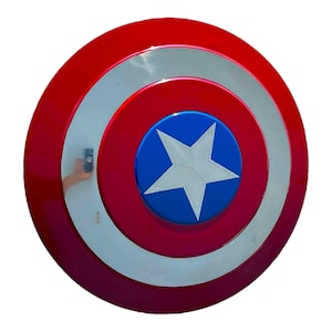 May include: A red, white, and blue Captain America shield. The shield is circular with concentric rings of red, white, and red. A blue circle in the center features a white star. The shield is a prop or collectible.