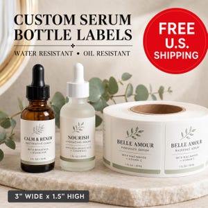May include: Custom serum bottle labels measuring 3 inches wide by 1.5 inches high. The labels are white with green text and a leaf graphic. Two glass dropper bottles are shown with labels applied, and a roll of labels is displayed to the right.