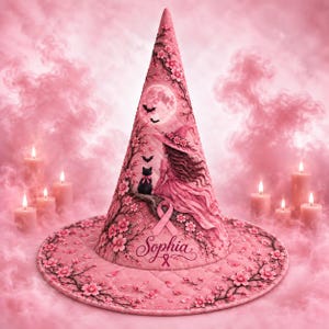 May include: A pink pointed hat featuring a quilted texture and a printed design of a person in a dress, a black cat, bats, a full moon, and cherry blossoms. The name Sophia is written in cursive script above a pink awareness ribbon.