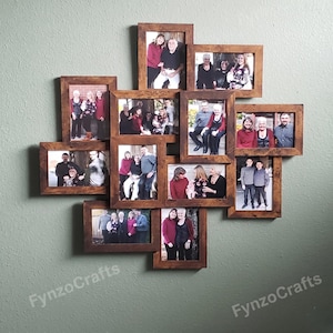 May include: A multi-photo wall collage with ten wooden frames, each holding a different family photo. The frames are arranged in a cross-like pattern against a light green wall. The photos feature various family members in different settings.