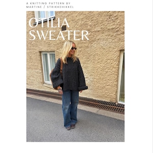 May include: A dark charcoal gray long-sleeved sweater with a ribbed texture, a crew neckline, and wide cuffs. The text A KNITTING PATTERN BY MARTINE / STRIKKEHIKKEL and OTILIA SWEATER is printed in white over the image of the sweater.