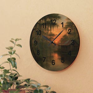 Bayou Sunset Acrylic Wall Clock, Louisiana Art, Rustic Swamp Cabin Art, Nature Print
Warm evening light filters across moss-draped cypress and a quiet swamp cabin on this acrylic wall clock. The soft, painterly scene brings a calm, reflective mood to a living room, reading nook, or bayou cottage. Lightweight yet durable, the glossy acrylic face keeps the colors rich while the easy keyhole slot on the back makes mounting effortless.