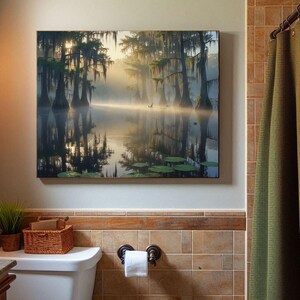 27-006 | Bayou Sunrise Print: Louisiana Bayou Art, Misty Swamp Cypress Trees (Digital Download)

A tranquil Louisiana swamp awakens beneath a golden sunrise, where cypress trees draped in Spanish moss stand like ancient sentinels over still waters. Mist curls gently above the surface, softening reflections and lending a dreamlike hush to the scene.