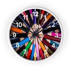 Colorful Art Pencil Starburst Wall Clock - A Whimsical Timepiece for Creative Spaces. Unique colorful pencil art wall clock.