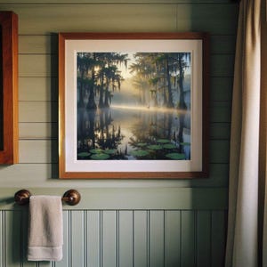 27-006 | Bayou Sunrise Print: Louisiana Bayou Art, Misty Swamp Cypress Trees (Digital Download)

A tranquil Louisiana swamp awakens beneath a golden sunrise, where cypress trees draped in Spanish moss stand like ancient sentinels over still waters. Mist curls gently above the surface, softening reflections and lending a dreamlike hush to the scene.