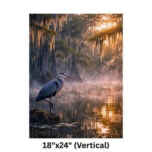 Poster | Louisiana Bayou Sunrise Print, Swamp Art, Southern Landscape, Nature Art, Tranquil Artwork

Step into the tranquil beauty of the Deep South with this atmospheric art print featuring a misty Louisiana swamp at sunrise. A majestic great blue heron stands poised on a mossy stump, its silhouette framed by golden light filtering through ancient cypress trees draped in Spanish moss. The still water mirrors the soft glow of dawn and scattered lily pads, creating a serene, dreamlike reflection.