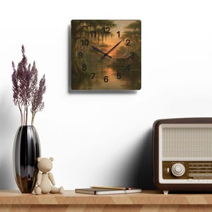 Bayou Sunset Acrylic Wall Clock, Louisiana Art, Rustic Swamp Cabin Art, Nature Print
Warm evening light filters across moss-draped cypress and a quiet swamp cabin on this acrylic wall clock. The soft, painterly scene brings a calm, reflective mood to a living room, reading nook, or bayou cottage. Lightweight yet durable, the glossy acrylic face keeps the colors rich while the easy keyhole slot on the back makes mounting effortless.