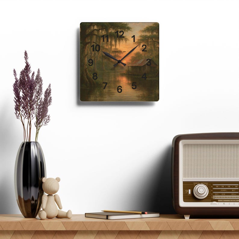 Bayou Sunset Acrylic Wall Clock, Louisiana Art, Rustic Swamp Cabin Art, Nature Print
Warm evening light filters across moss-draped cypress and a quiet swamp cabin on this acrylic wall clock. The soft, painterly scene brings a calm, reflective mood to a living room, reading nook, or bayou cottage. Lightweight yet durable, the glossy acrylic face keeps the colors rich while the easy keyhole slot on the back makes mounting effortless.