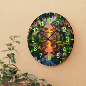 Mossy Bayou Sunset Acrylic Wall Clock | Swamp Herons, Spanish Moss

Floating sunlight slips between cypress trunks as herons stand watch — this acrylic wall clock brings a quiet bayou morning into your room. Lightweight yet sturdy, the glossy print keeps colors rich so the sunrise and moss-draped branches glow against the clock face.