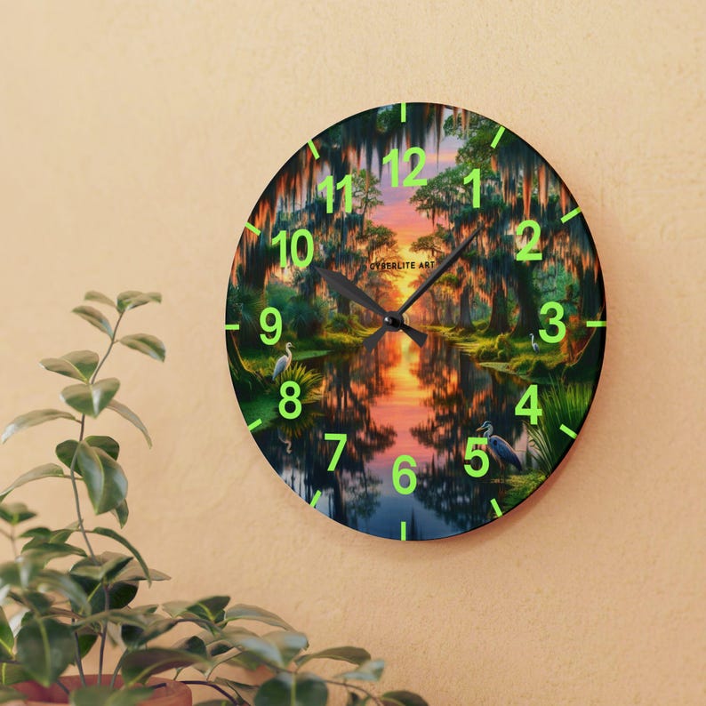 Mossy Bayou Sunset Acrylic Wall Clock | Swamp Herons, Spanish Moss

Floating sunlight slips between cypress trunks as herons stand watch — this acrylic wall clock brings a quiet bayou morning into your room. Lightweight yet sturdy, the glossy print keeps colors rich so the sunrise and moss-draped branches glow against the clock face.
