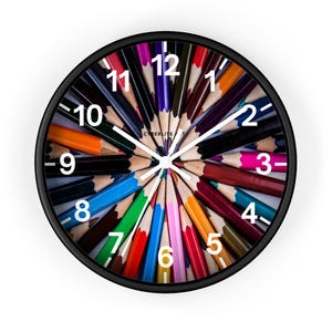 Colorful Art Pencil Starburst Wall Clock - A Whimsical Timepiece for Creative Spaces. Unique colorful pencil art wall clock.
