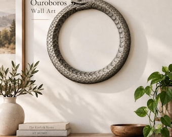 May include: A circular wall art piece depicting an Ouroboros snake biting its own tail. The sculpture features a textured, grey, stone-like finish with detailed scales. The text Ouroboros Wall Art is printed in black to the left of the snake sculpture.