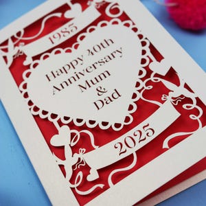 Close up detail of the cut out 40th anniversary card. Text in the heart reads Happy 40th Anniversary Mum & Dad