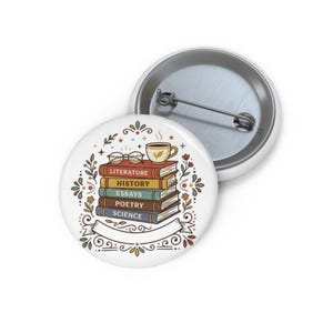 May include: A round pin-back button featuring a stack of five books labeled Literature, History, Essays, Poetry, and Science. A pair of glasses and a steaming cup of coffee rest on top. The design includes floral accents and a blank white banner.