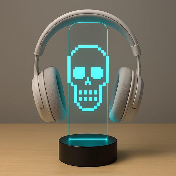 A pixel-skull LED headphone stand with RGB lighting and custom name — functional desk art that doubles as a gaming setup centerpiece.