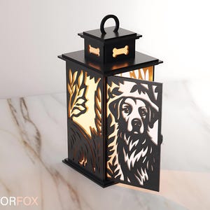 May include: Black wooden lantern with a dog design on the door. The lantern has a handle and bone-shaped cutouts. The interior glows with a warm light, and the design includes tree and leaf cutouts.