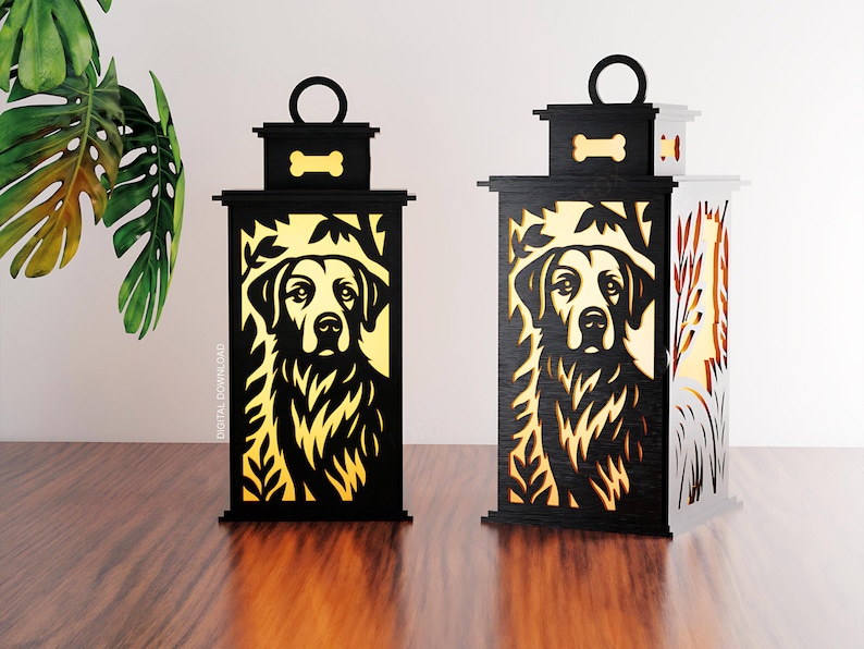 May include: Two decorative lanterns with a dog silhouette design. The lanterns are black with a golden-yellow interior, featuring a dog portrait. Each lantern has a handle and a bone-shaped accent. The lanterns are on a wooden surface.