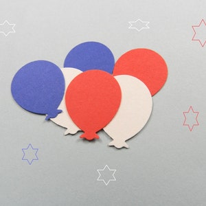 May include: Five paper balloons in red, white, and blue colors. The balloons are arranged in a cluster, with the red balloon at the top and the white balloon at the bottom.