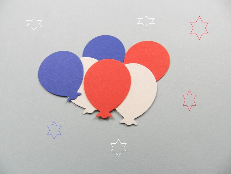 May include: Five paper balloons in red, white, and blue colors. The balloons are arranged in a cluster, with the red balloon at the top and the white balloon at the bottom.