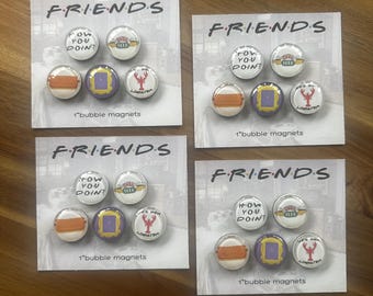 May include: Four sets of five circular bubble magnets on white backing cards labeled FRIENDS and 1" bubble magnets. Each set features icons including a couch, a purple frame, a lobster, a coffee cup, and the text HOW YOU DOIN?