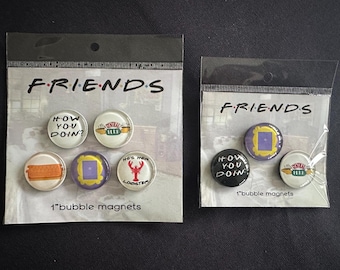 May include: Two packages of Friends-themed bubble magnets. One package contains six 1-inch magnets, and the other contains three. The magnets feature iconic imagery and phrases from the TV show, such as "How You Doin?" and the Central Perk logo.