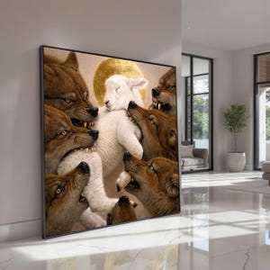 May include: A framed artwork depicts a white lamb surrounded by snarling brown wolves. The lamb has a golden halo, and the wolves' teeth are bared. The artwork is displayed in a modern, well-lit room with large windows and a minimalist aesthetic.