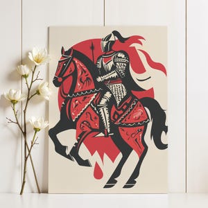 May include: A framed print featuring a stylized illustration of a knight on horseback. The artwork uses a limited color palette of red, black, and cream. The knight is clad in armor, and the horse is adorned with decorative patterns. A red sun shape is in the background.