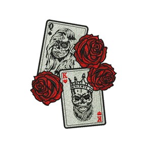 May include: Embroidered patch featuring playing cards and red roses. The Queen of Spades card depicts a woman with sugar skull makeup. The King of Spades card shows a skull wearing a crown. Three red roses are also included.