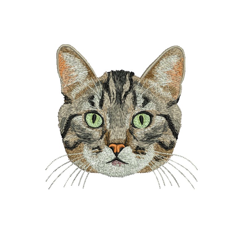 May include: Embroidered cat face with green eyes, a pink nose, and whiskers. The cat's fur is a mix of brown, gray, and black, with detailed stitching. The cat's head is centered on a white background.