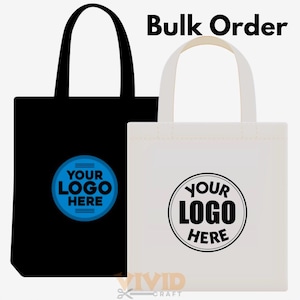 May include: Two tote bags, one black and one white, with the text "Bulk Order" at the top. Each bag has a circular logo area with the words "YOUR LOGO HERE". The bags have handles for carrying.