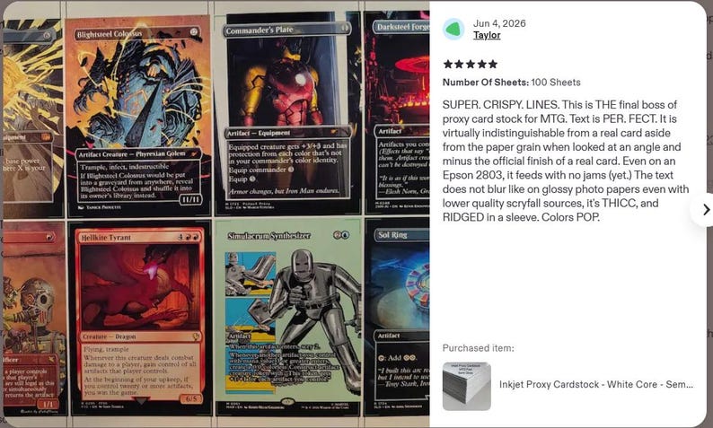 May include: A collection of rectangular trading cards featuring various fantasy illustrations, including a large metallic golem, a red dragon, and a silver robot figure. Each card displays detailed text, game statistics, and vibrant artwork with black borders, arranged in a grid layout on a flat surface.
