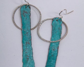 Hammered and oxidized copper and sterling silver drop earrings.