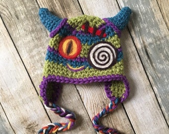 PRE-ORDER Creepy Cute Baby Monster Earflap Hat With Dragon Swirly Eyes, Scar & Demon Horns. Boys and Girls Halloween Costume Stripe Beanie