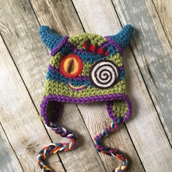 PRE-ORDER Creepy Cute Baby Monster Earflap Hat With Dragon Swirly Eyes, Scar & Demon Horns. Boys and Girls Halloween Costume Stripe Beanie