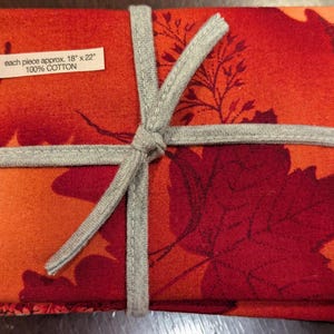 7 piece Fat Quarter Bundle 100% cotton fabric rust to orange color various prints see picture for number of fat quarters per print