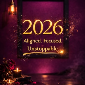 May include: A digital art image with the golden text "2026" and the words "Aligned. Focused. Unstoppable." against a dark purple background. The image includes candles, books, and a pen.