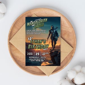 May include: A Star Wars themed birthday party invitation featuring The Mandalorian and Grogu. The invitation includes the text "Ethan's Birthday Party" with the date, time, and RSVP information. The invitation is on a wooden tray with a brown envelope.