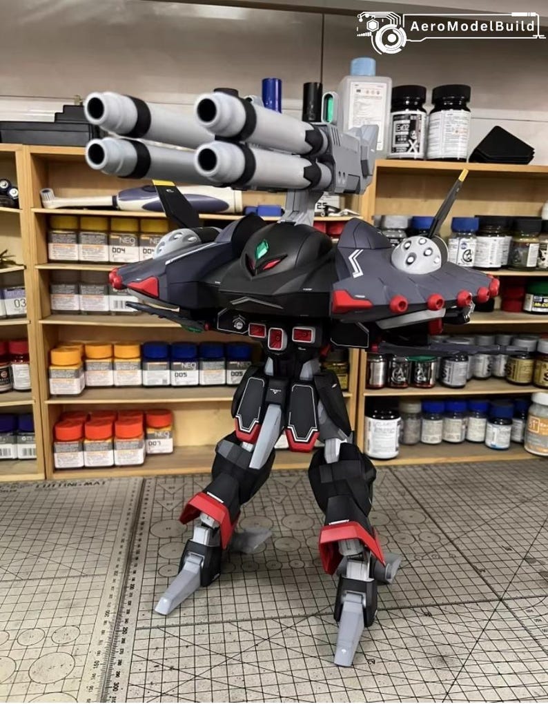 May include: A detailed model of a black, gray, and red mech with multiple missile launchers. The model has articulated legs and arms, with red accents on the feet and shoulders. The model is on a cutting mat with a grid pattern.