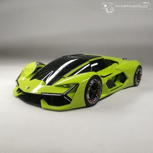 Könnte beinhalten: Ein limettengrünes Modell-Sportwagen mit schwarzen Akzenten und einem schwarzen Dach. Das Auto hat ein schlankes, aerodynamisches Design mit detaillierten Rädern. Der Text "ArrowModelBuild" ist oben rechts sichtbar. Das Design ist sportlich.
