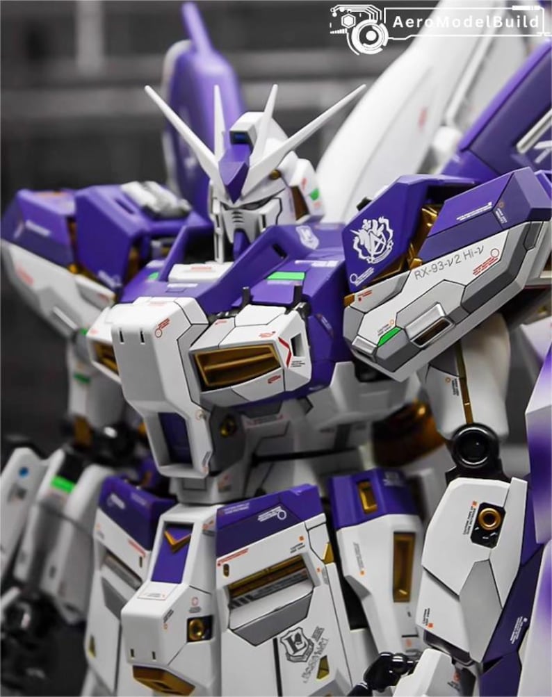 May include: A detailed model of a mecha robot, primarily white and purple, with gold accents. The robot has a complex design with multiple panels, sharp edges, and a detailed head. The image includes the text "AeroModelBuild".