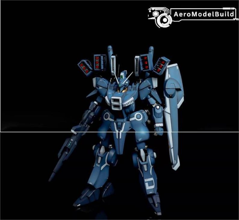 May include: A blue and white model robot with a shield and gun, set against a black background. The robot has multiple missile launchers and the text "AeroModelBuild" in the upper right corner.