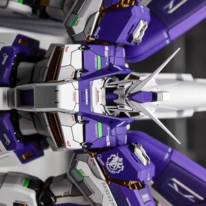May include: A detailed model of a futuristic robot, primarily in shades of purple, white, and gray. The model features intricate mechanical details, sharp angles, and gold accents. The text "AeroModelBuild" is visible in the top right corner.