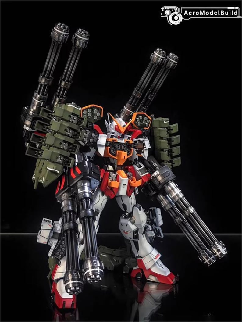 May include: A highly detailed model robot, showcasing a complex design with numerous cannons and weaponry. The robot is predominantly white, red, and orange, with black and silver detailing. The image is set against a dark backdrop, emphasising the intricate details of the model.
