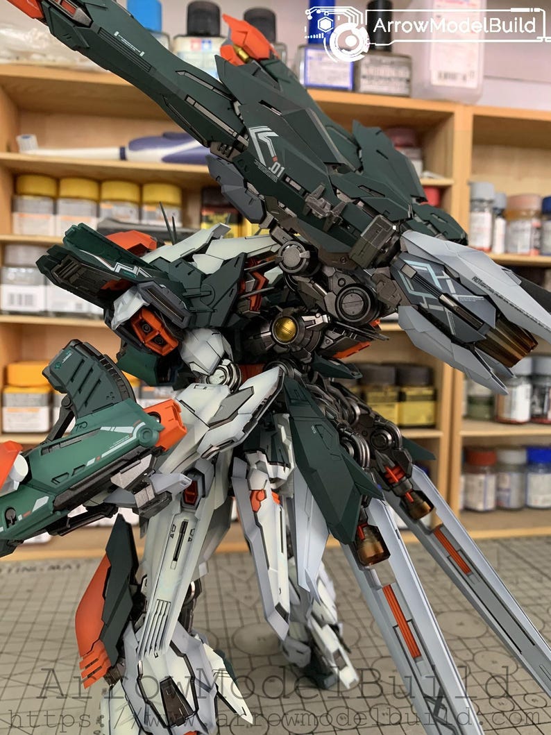 May include: A detailed model of a futuristic robot with a complex design. The robot features a color scheme of dark green, white, orange, and silver. The model is highly detailed, with visible mechanical components and intricate paneling.
