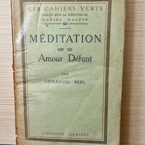 May include: A vintage book cover with the title "MÉDITATION sur un Amour Défunt" by Emmanuel Berl. The book is part of the "Les Cahiers Verts" series, published under the direction of Daniel Halévy.