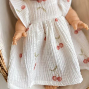 Cherry Print Muslin Dress for Dolls – Handmade Summer Outfit for 34–38cm Dolls – Fits Miniland, Paola Reina, Minikane – Fruit Doll Gift