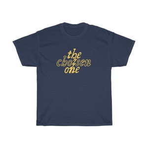 May include: A navy blue t-shirt with the text "the chosen one" in yellow.