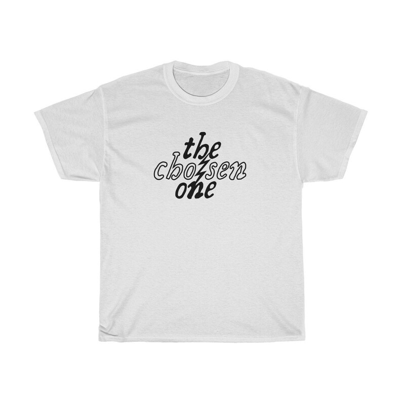 May include: White t-shirt with black text that reads "the chosen one" in a stylized font.